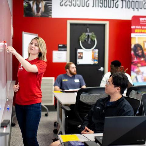 a student tutoring another inside the Learning Resource Center